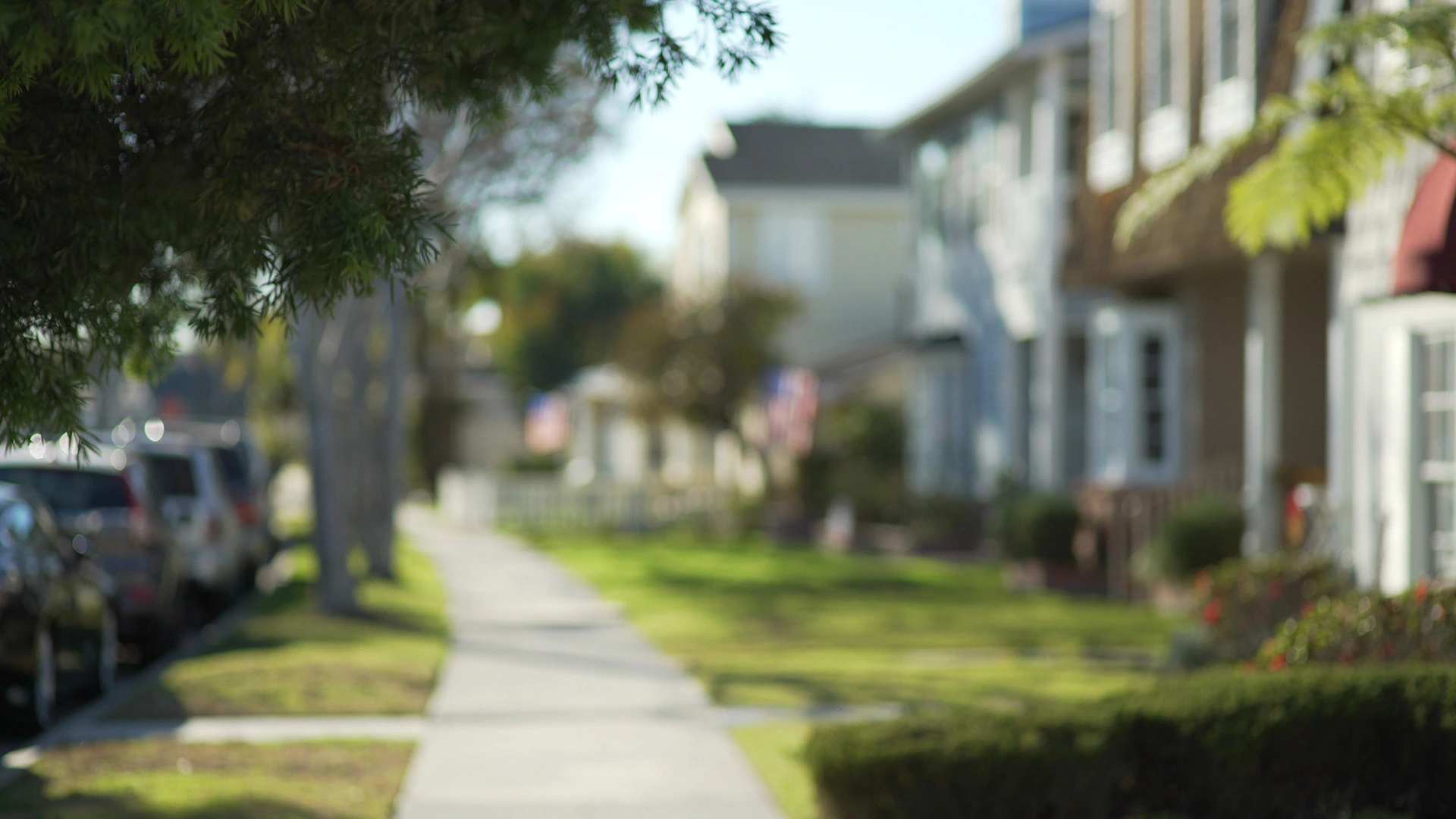 Blurred sidewalk view of a neighborhood in Forney, TX.