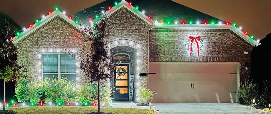Holiday lights installed around a home in Wylie, TX.